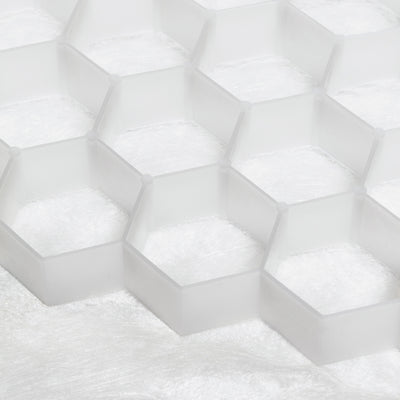 Close-up of white hexagonal tiles with a textured surface - the Core Path Pro substrate support system